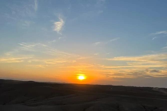 Sunset sky over the dunes of the Agafay Desert